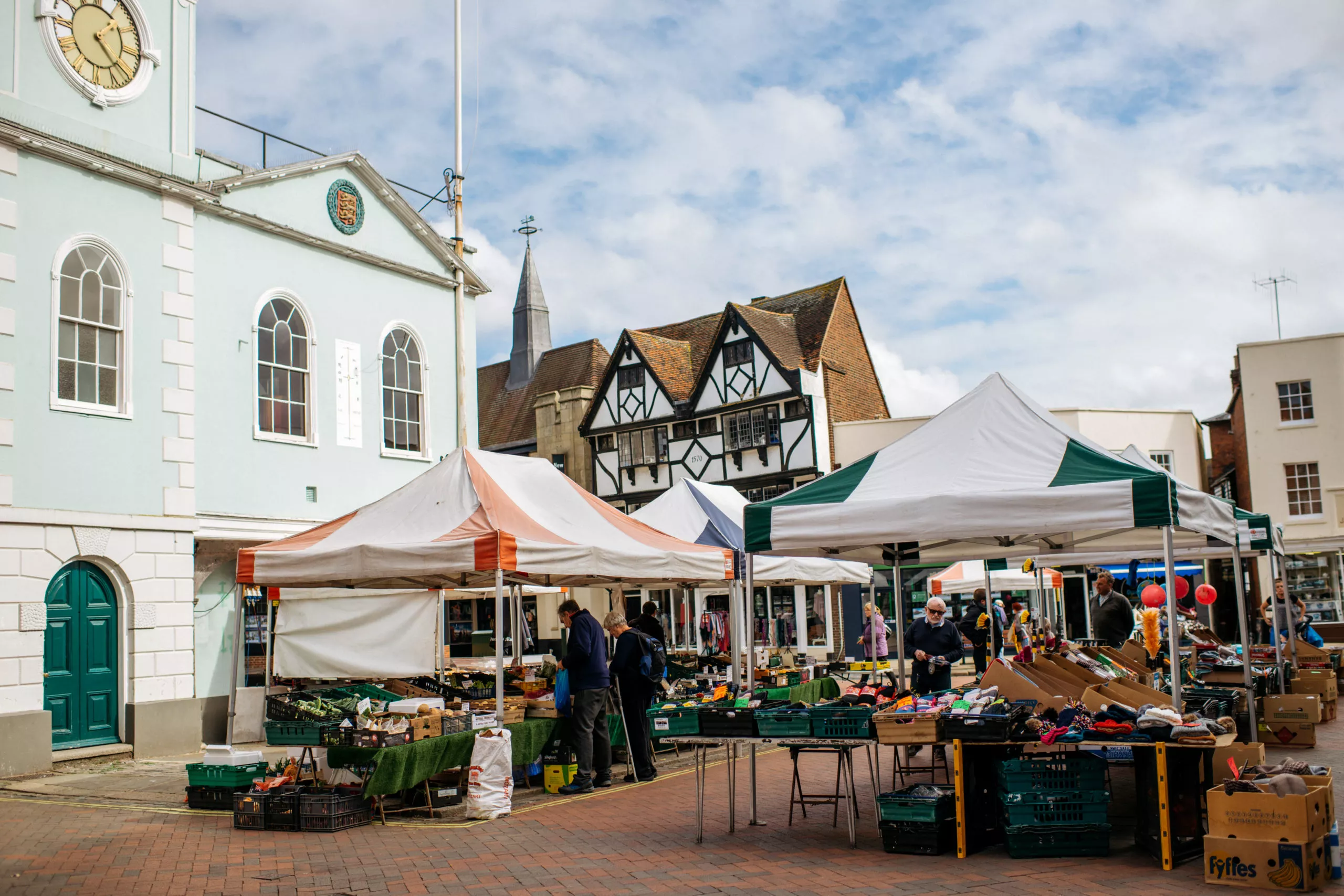 The market in Faversham, Kent all set up with stall holders selling local produce.