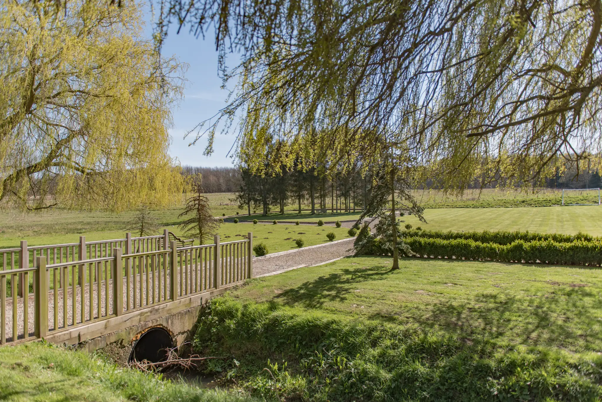 The expansive sunny garden at Honeywood Lodge, a big family friendly holiday home in Canterbury Kent.