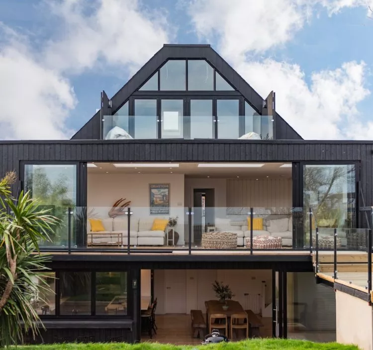 The outside view of Waters Edge, a designer beach house in Greatstone by Bloom Stays