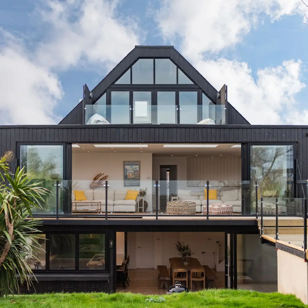The outside view of Waters Edge, a designer beach house in Greatstone by Bloom Stays