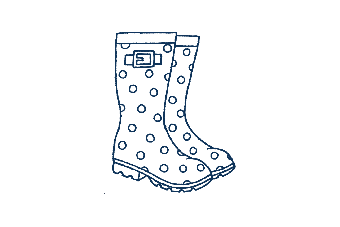 An illustration of a pair of wellington boots in navy with dots on.