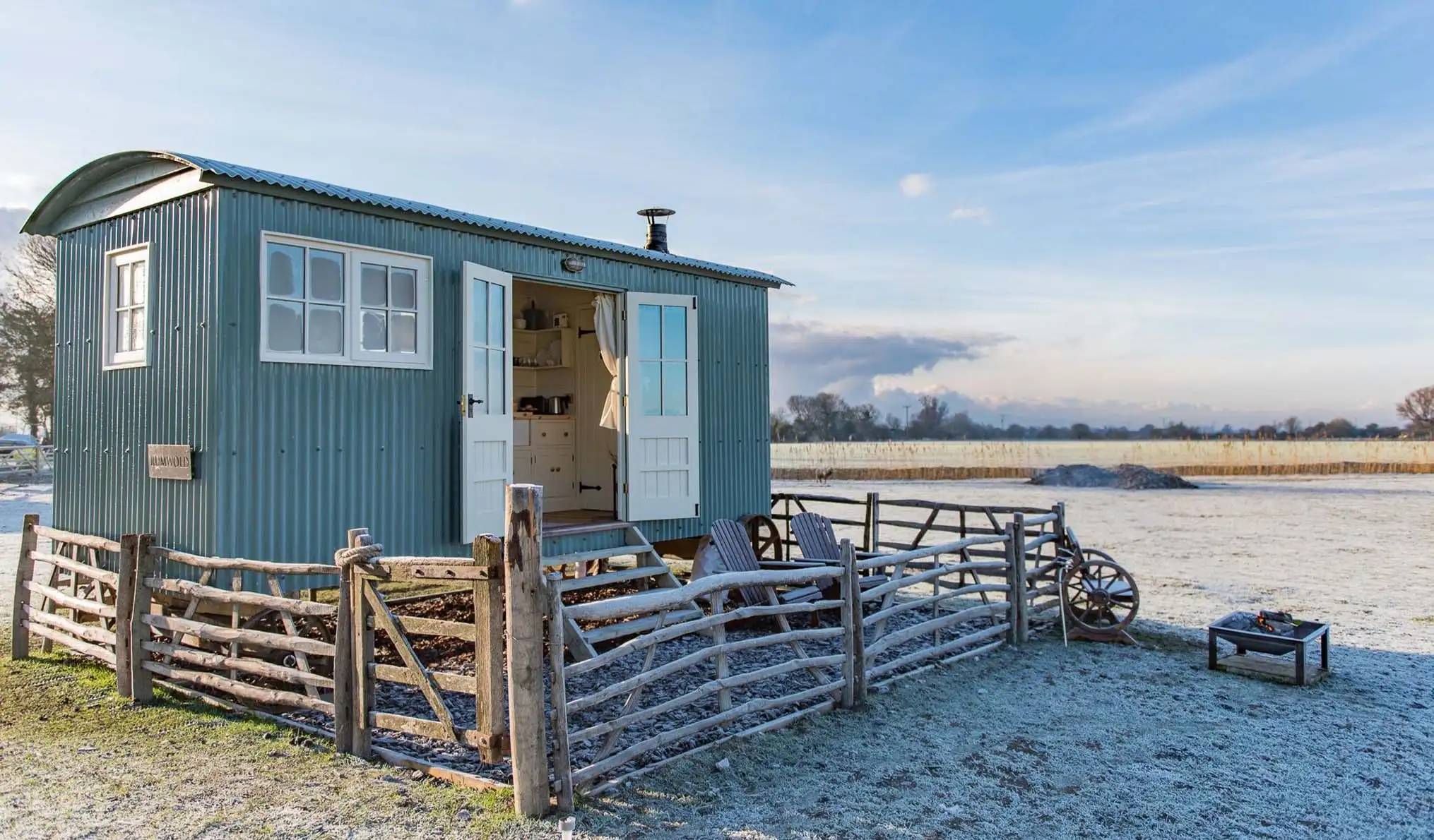 A frosty Shepherds Hut on the Romney Marsh Huts with the doors wide open.