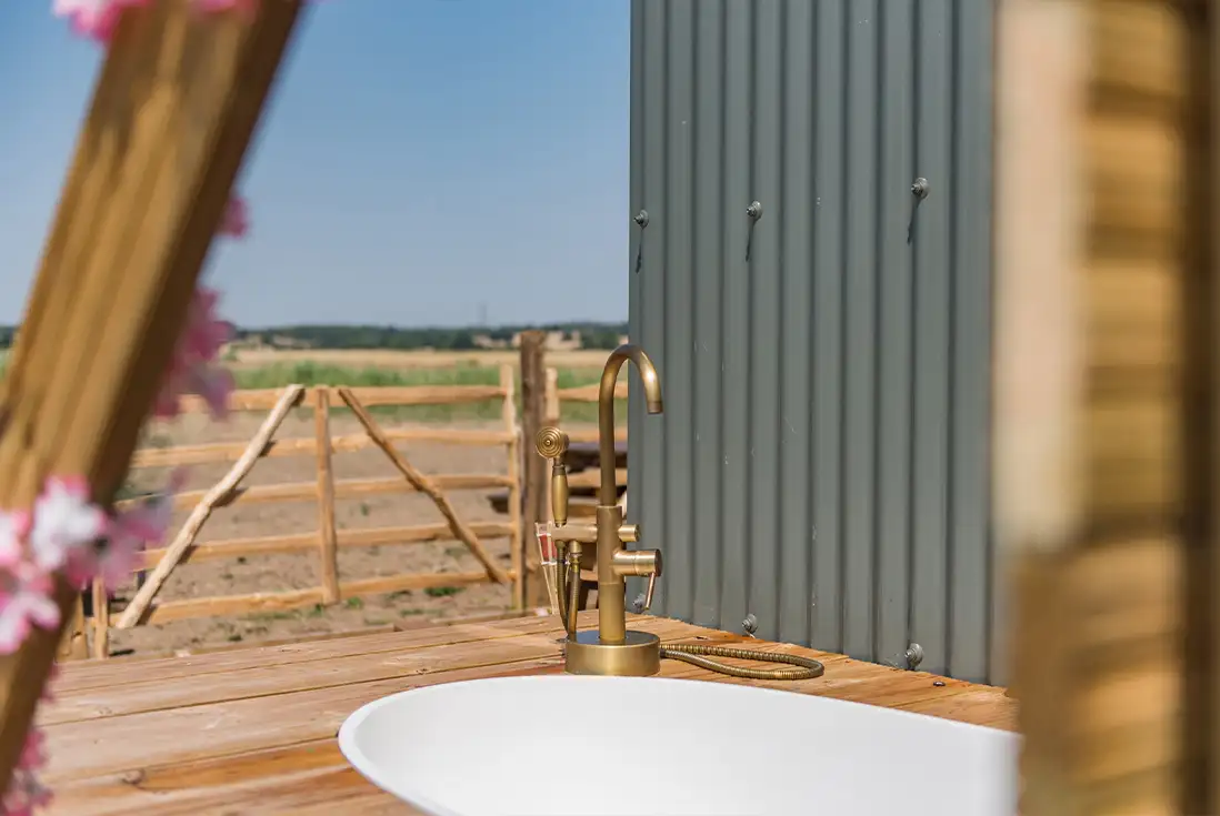 Outdoor bath and view of romney marsh