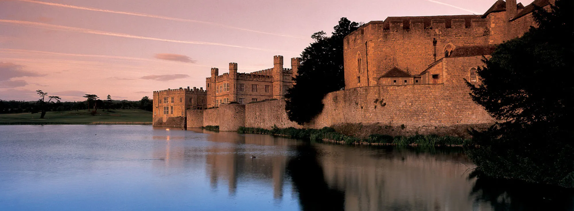 A beautiful photo of a pink sunset at Leeds Castle in Maidstone, Kent.