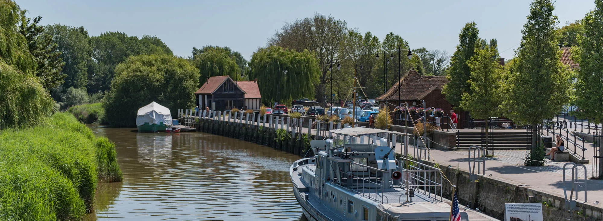 Boats going up and down the river in Sandwich, Kent.