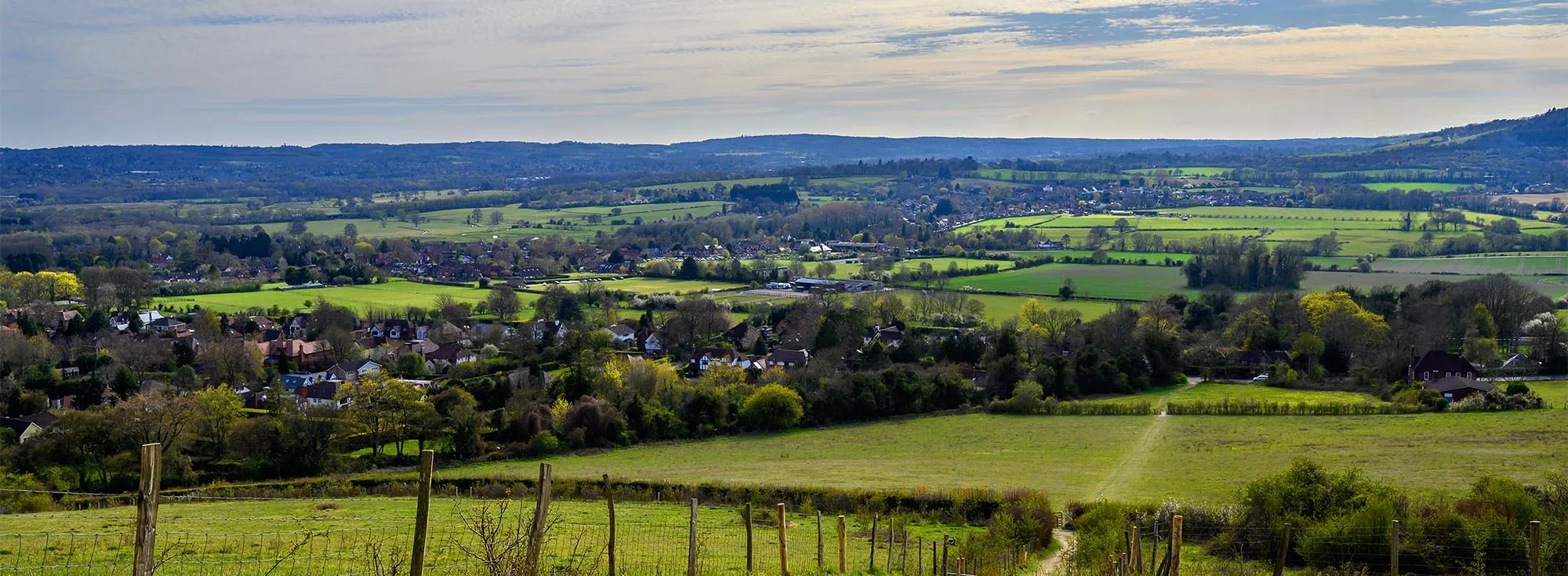 A wide, open view of the countryside hills in Sevenoaks, Kent, a lovely place for walking holidays.