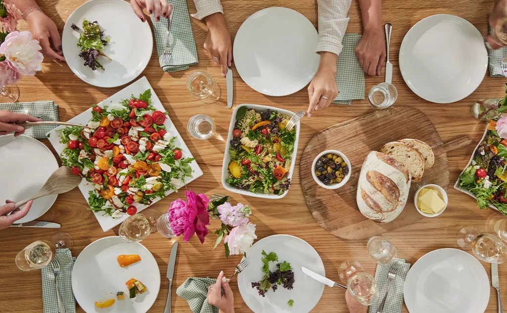 A table filled with salads by hired caterers for self catering holiday homes