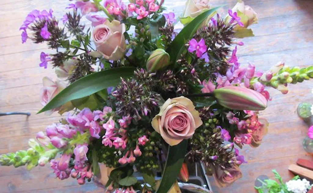 Beautiful pink and purple fresh cut flowers by the Kings Mile Florist