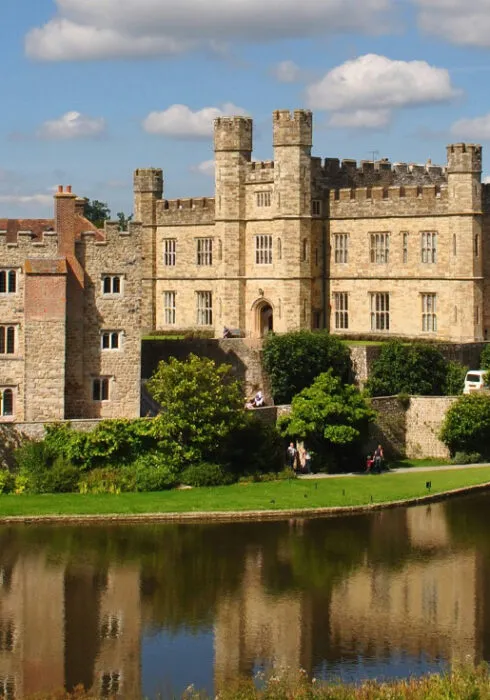 External shot of Leeds Castle in Maidstone, capturing the big mote that surrounds the castle grounds.