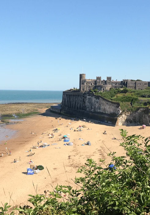 People sunbathing on the sandy beach at Broadstairs
