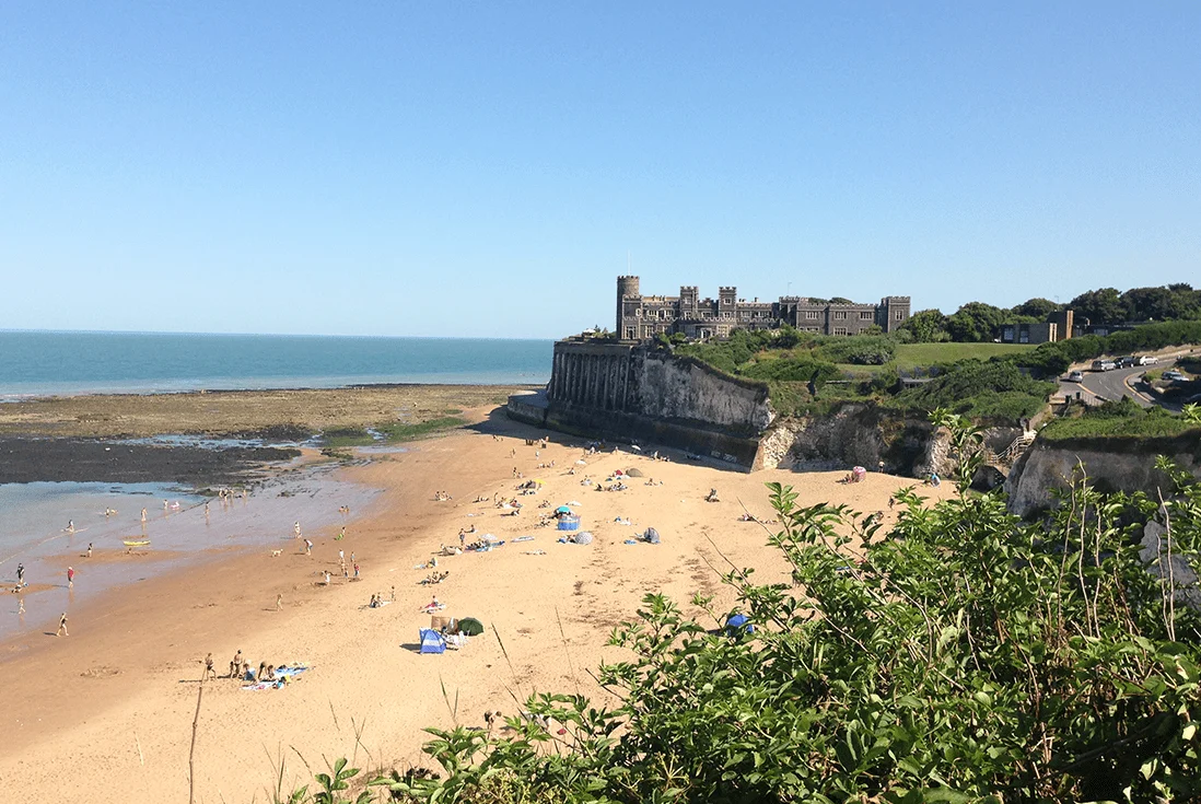 People sunbathing on the sandy beach at Broadstairs