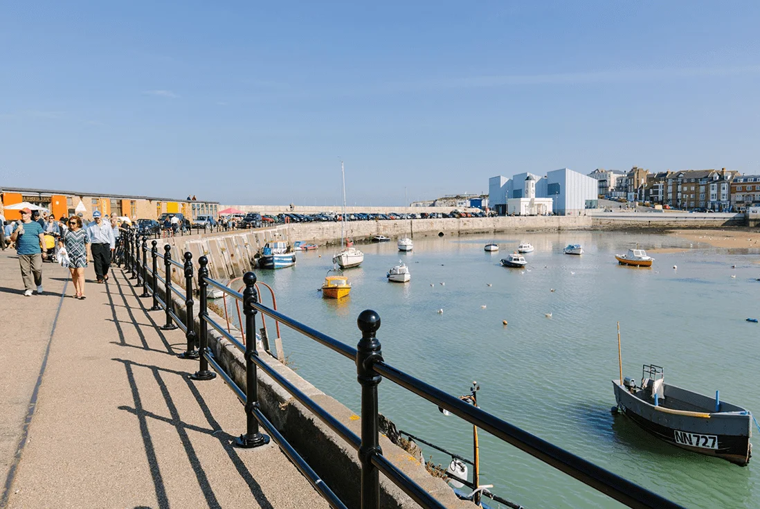 Blue skies and boats in the harbour at Margate seafront