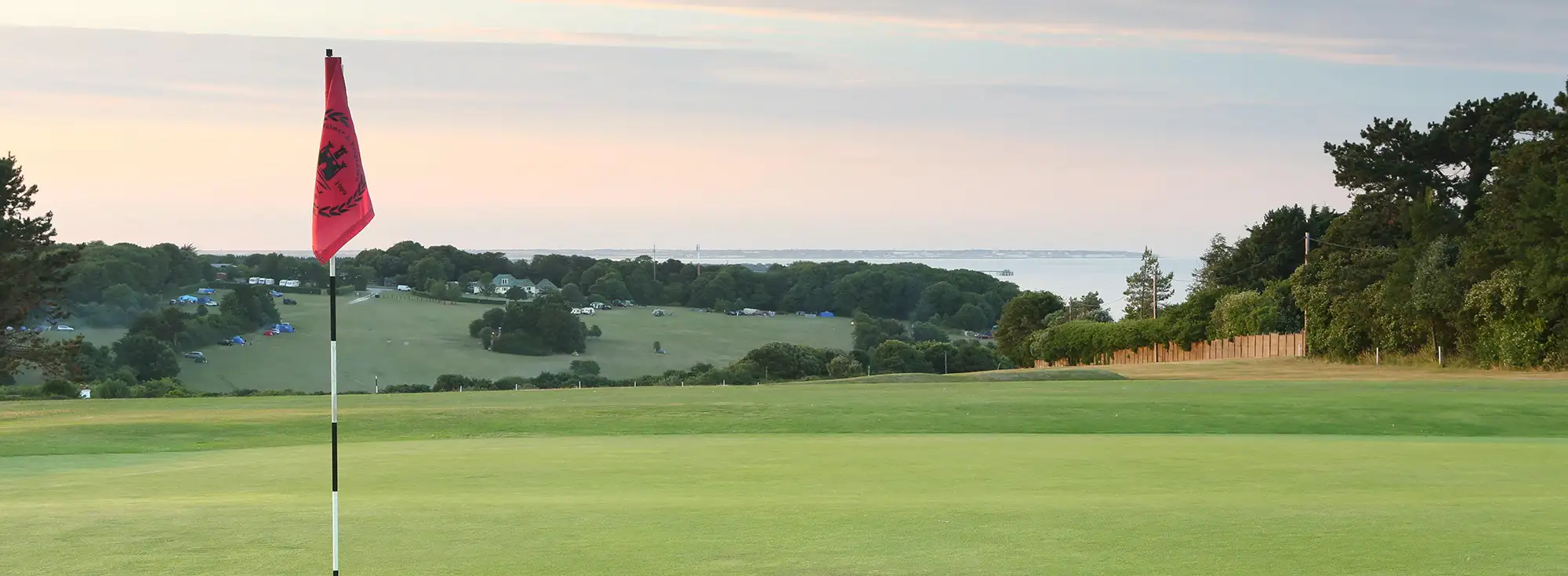 Wide open golf course at Kingdown in Kent overlooking the sea below.