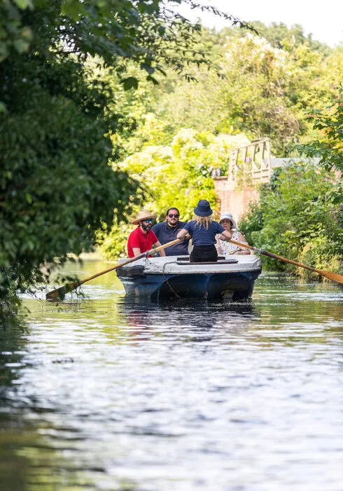 A group of friends on a river tour around Canterbury.