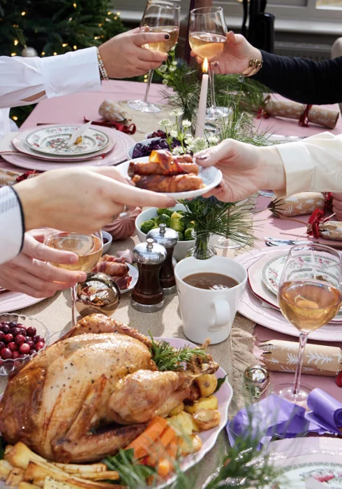 A group of people enjoying a Christmas dinner