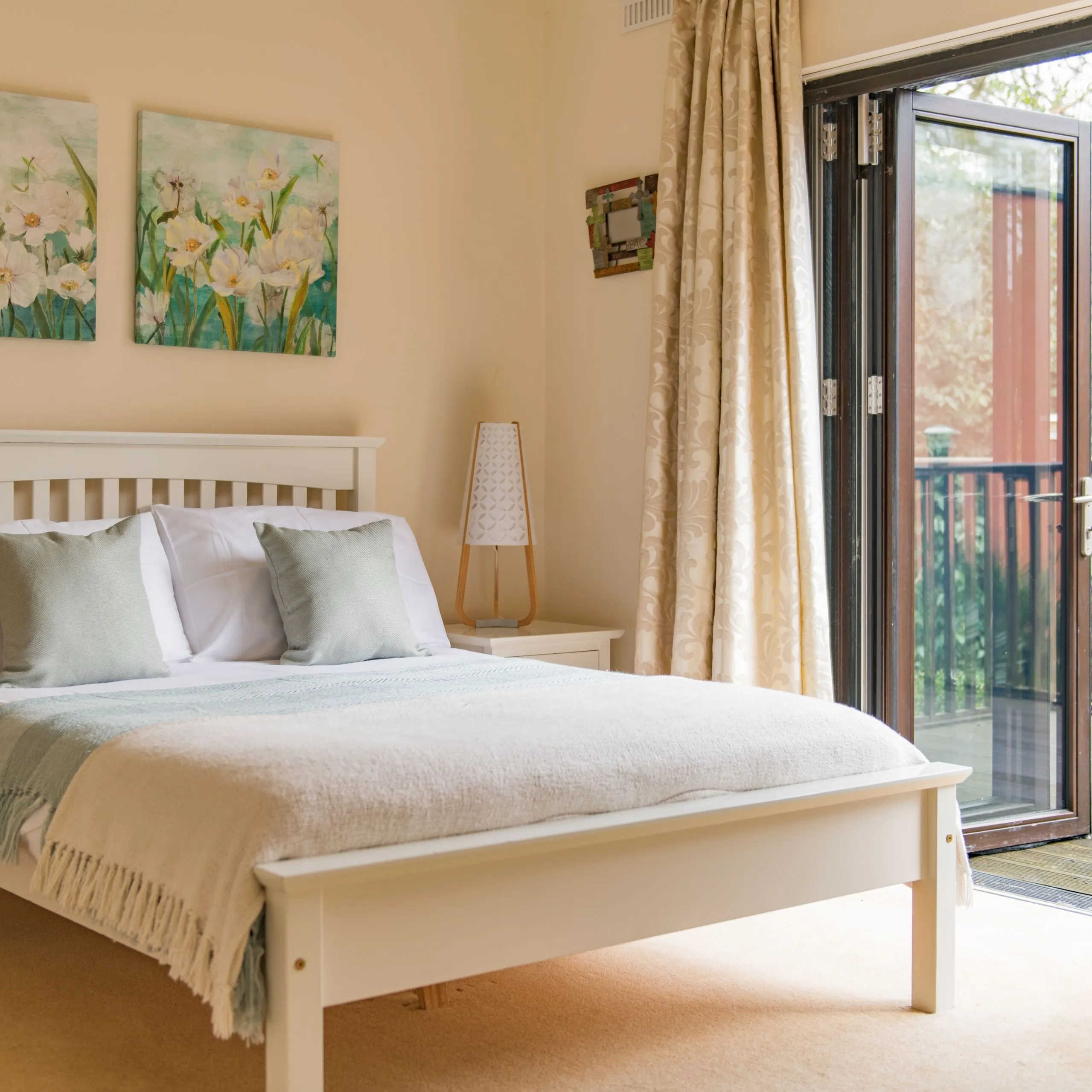 Bedroom leading out to balcony at Honeywood Lodge, Canterbury