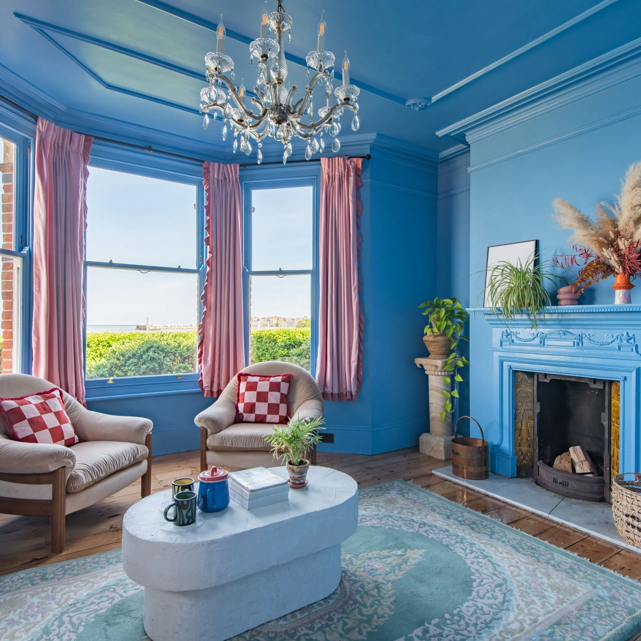 Colourful blue living room at Margate Beach House