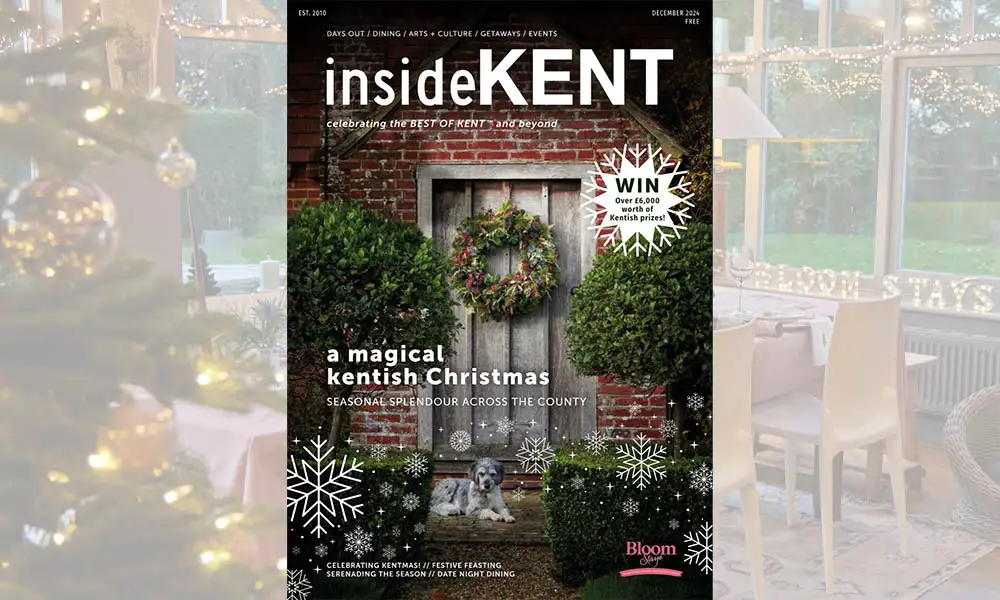 The Christmas front cover of InsideKent magazine, showing a dog sat in front of a Dormestone Farm, a holiday home by Bloom Stays