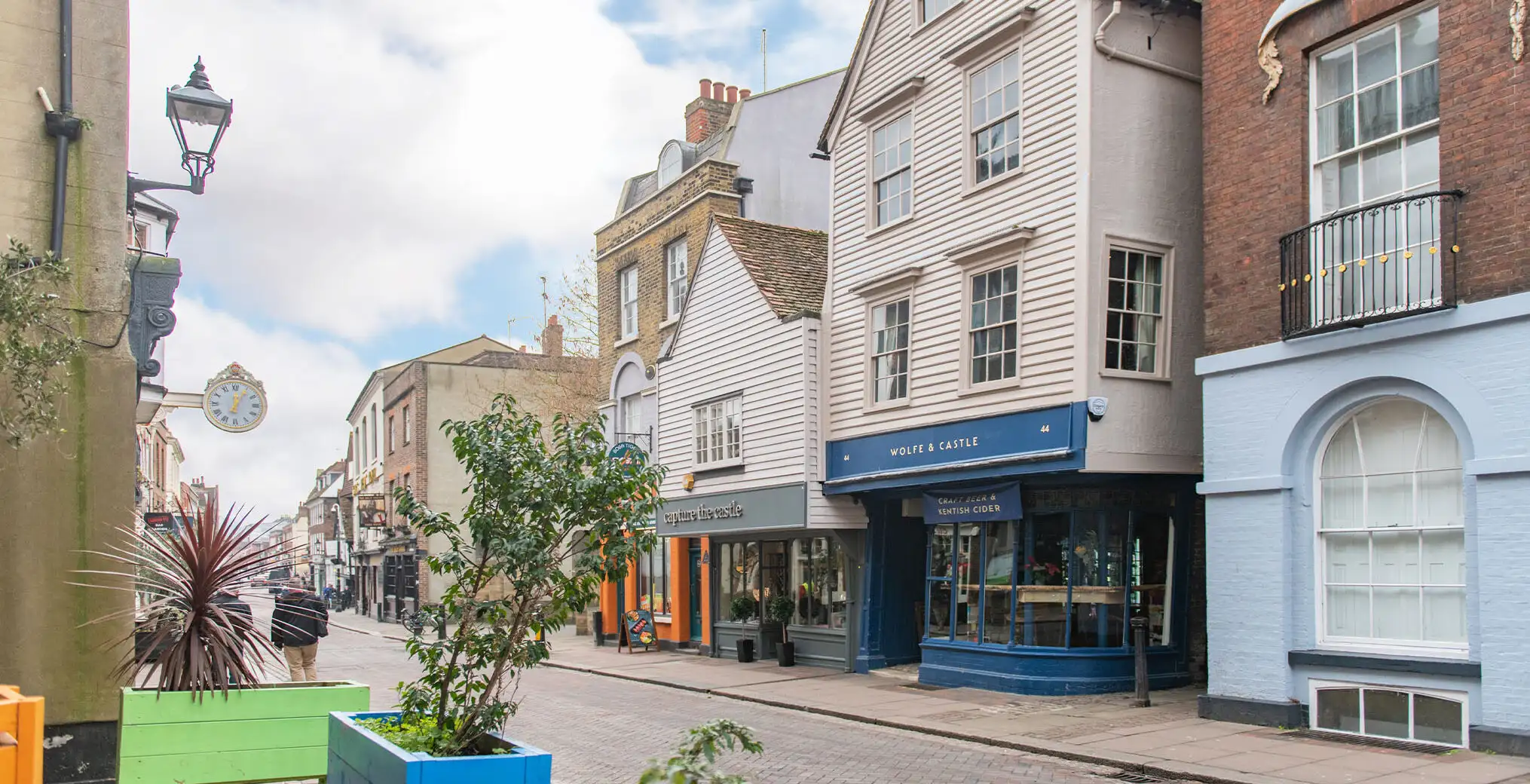A shot of Rochester high street including independent shops and pubs such as Wolfe & Castle.