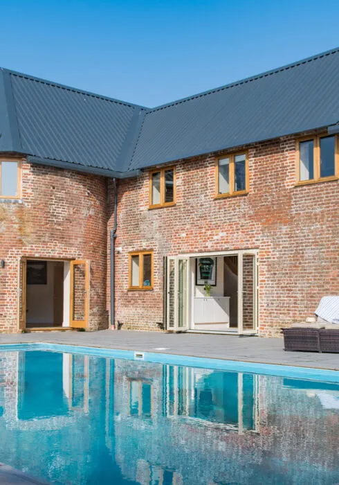 Each Manor Farm Oast, a holiday home in Ash, with a swimming pool and large bi folding doors