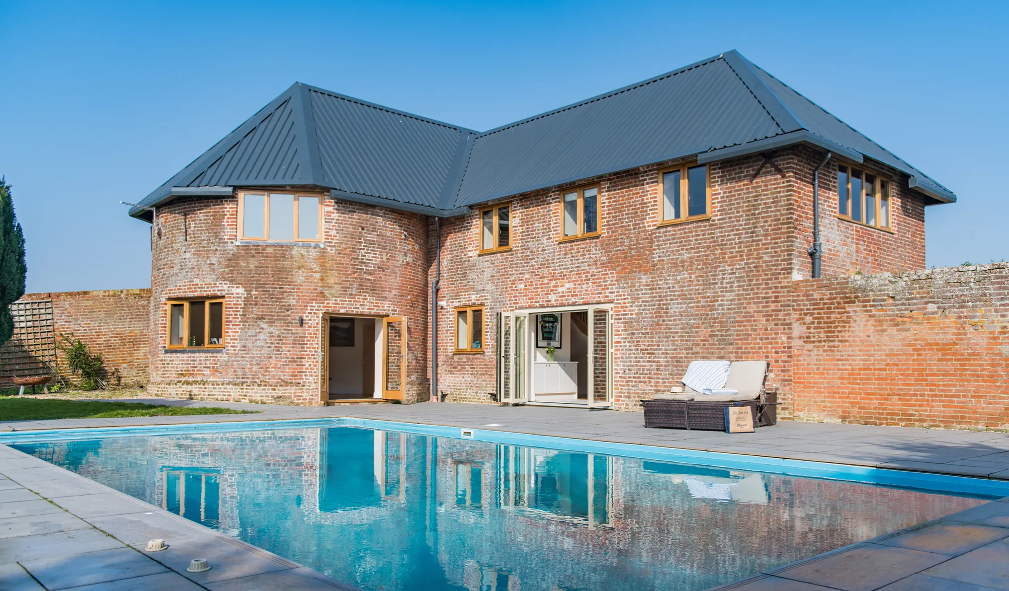 Each Manor Farm Oast, a holiday home in Ash, with a swimming pool and large bi folding doors